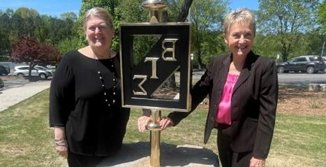 WSOB faculty with Beta Gamma Sigma statue